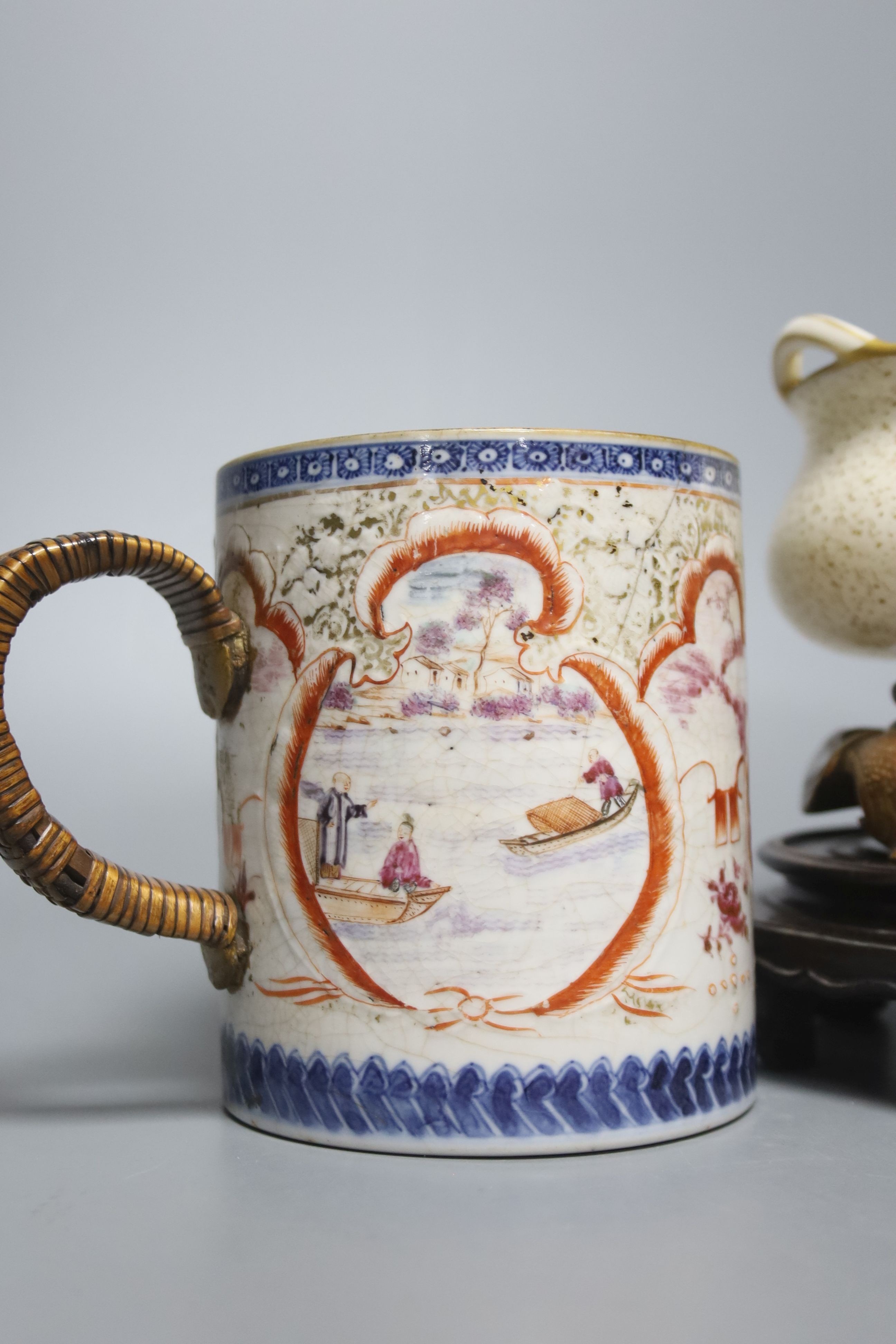 A Royal Worcester chinoiserie incense burner and integral stand, late 19th century, 11.5cmwide, wood stand and an 18th century Chinese export rose famille mug, with later metal handle